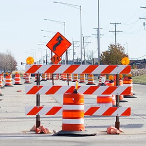 A highway work zone with orange and white cones - Leep Tescher Helfman and Zanze