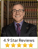 Image of  Attorney Benjamin Helfman with 4.9 star reviews sign